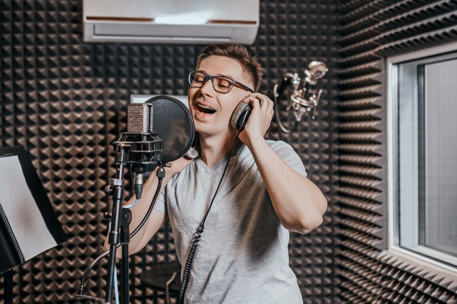 Man singing in a recording studio